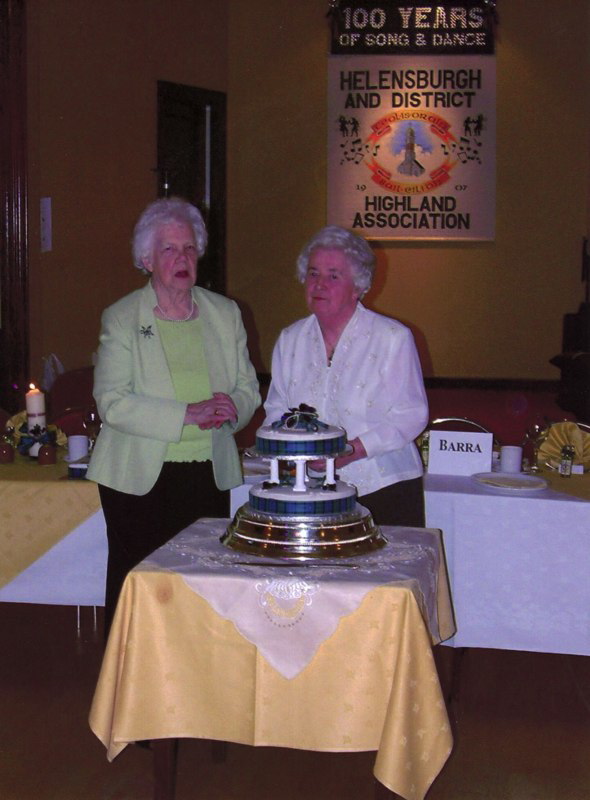 Flora Best & Katie MacDonald cut the Centenary Cake