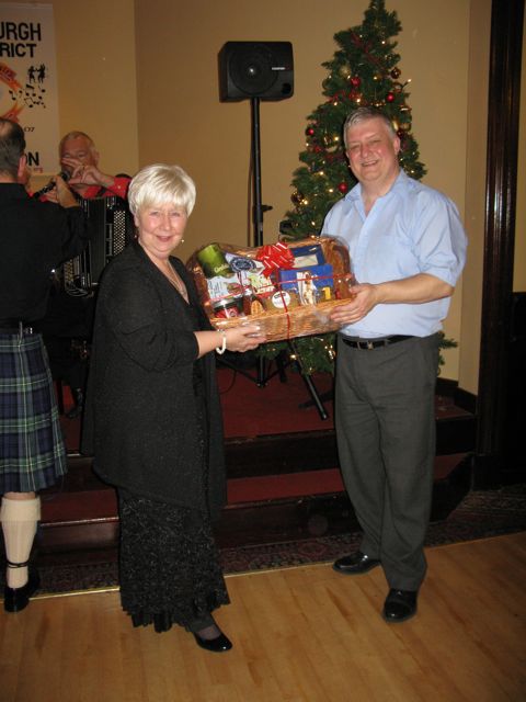 Rita Nicol wins the star raffle prize donated by Jean Hutton